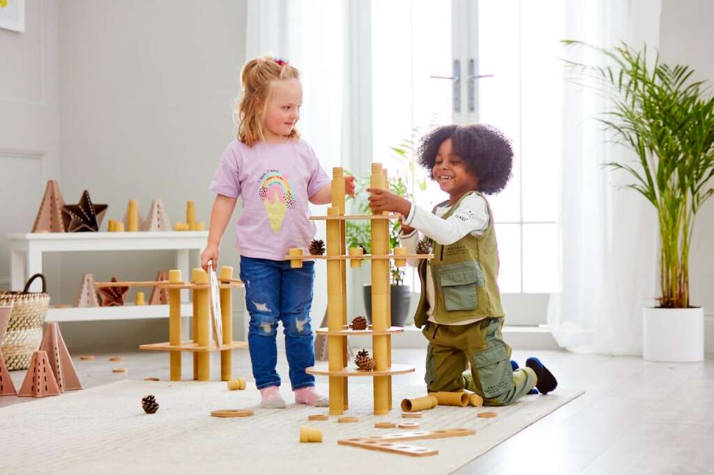 young girl and boy playing with Eco Build a World Resource